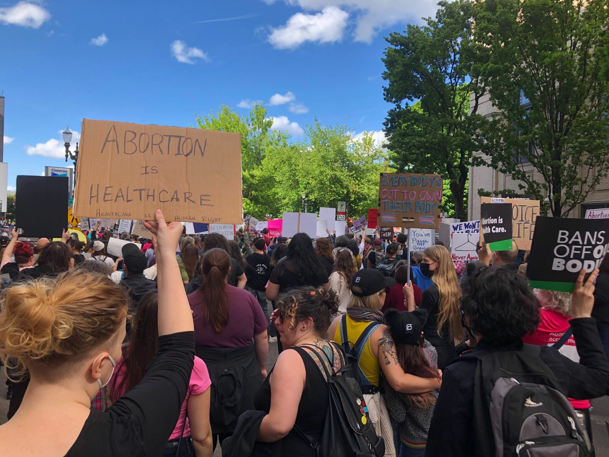 Pro-choice protesters in Portland, Oregon. A woman holds a sign that says "Abortion is healthcare"