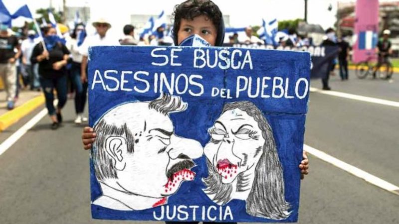 "Se busca asesinos del pueblo justicia" - poster