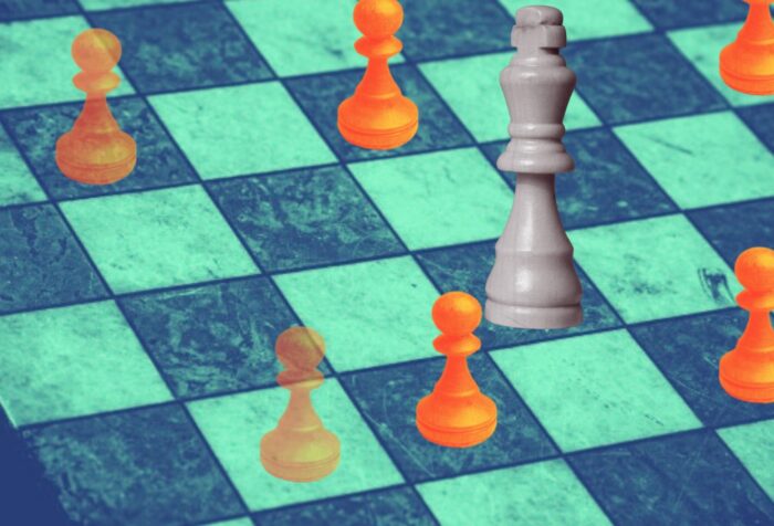 Stylized chess board with pieces in orange.