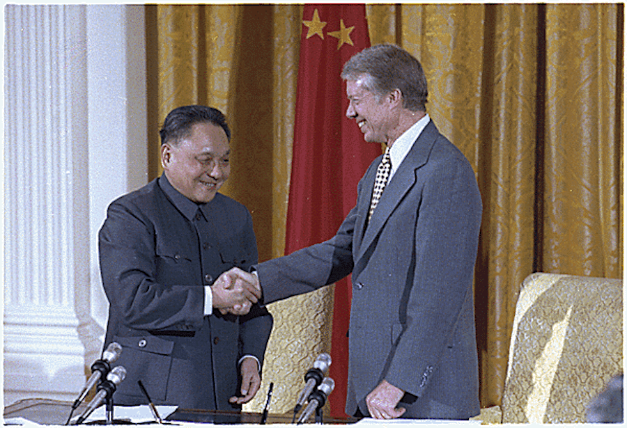 Chinese Premier Deng Xiaoping and U.S. President Jimmy Carter shaking hands after signing diplomatic agreements between the United States and China at the White House in January 1979.