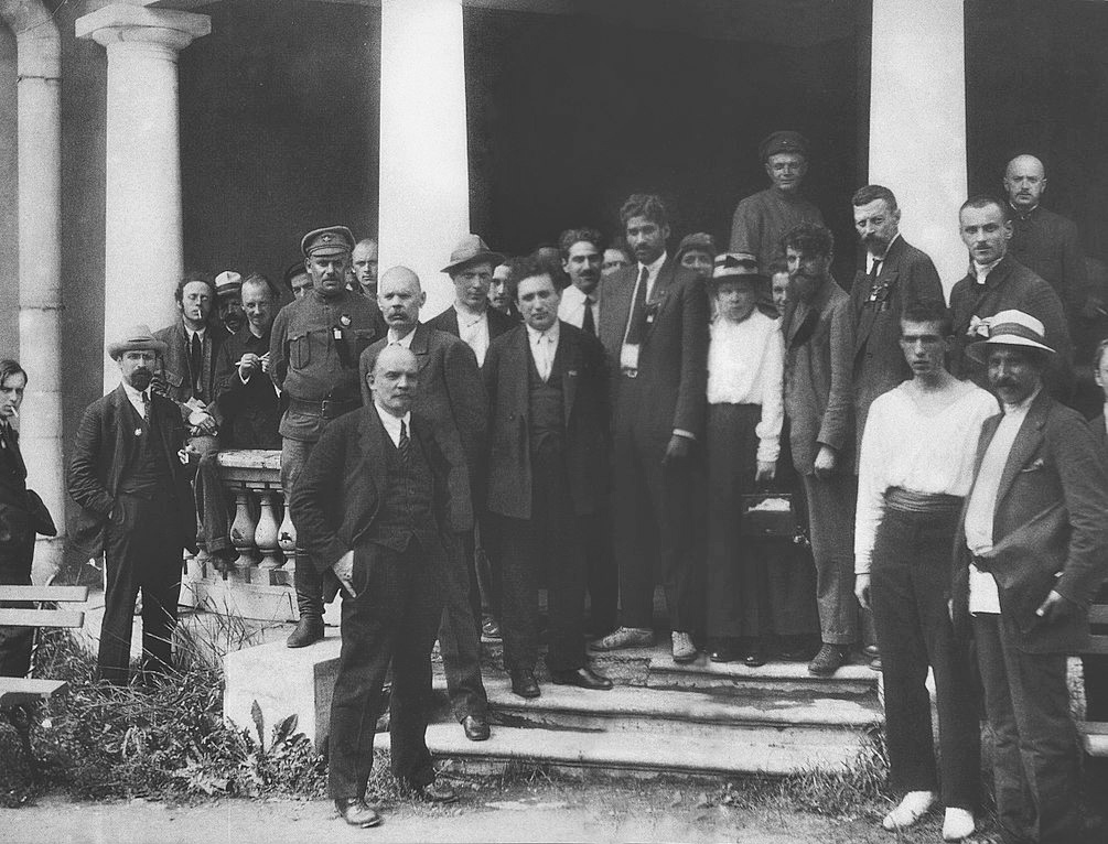 A group of men in suits standing in front of a building with columns. These men are the Comintern (the Third Communist International) at the annual conference in 1920.