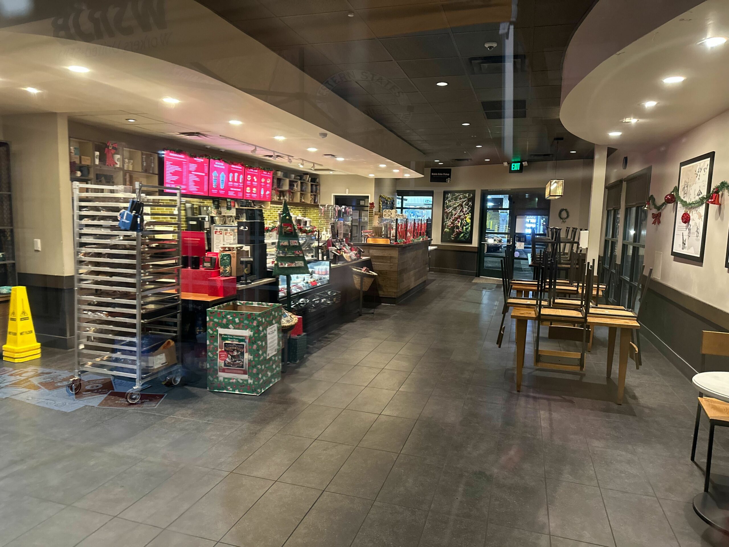 The inside of a deserted Starbucks store.