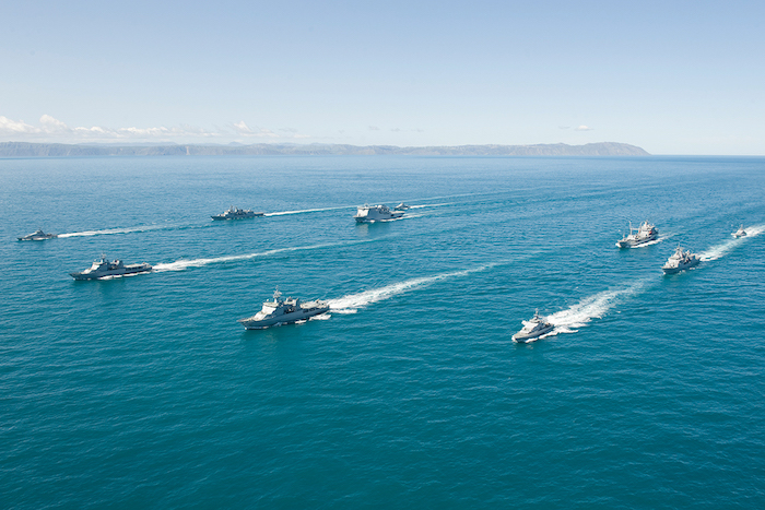 Photo of Chinese war games in the Taiwan Straits, 2018, which shows a group of eight navals vessels in formation.