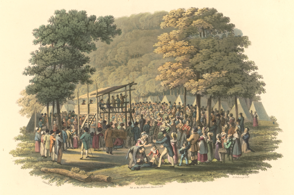 Hand-colored engraving of a big outdoor meeting with speakers on a raised wooden platform. The scene is framed by large trees, and the peaks of white tents are visible behind.